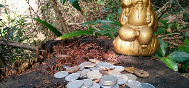 statue and coins